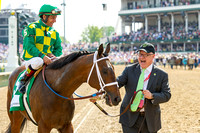 Owner Jerry Crawdford smiles at his Finnigan's Wake, with Victor Espinoza aboard, after winning the Woodford Reserve Turf Classic (GI) at Churchill Downs in Louisville, Kentucky.