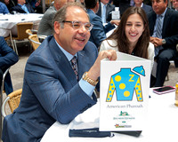 Ahmed Zayat poses with the American Pharoah placard at the Belmont Stakes Post Draw in Rockefeller Center in Manhattan, New York.