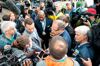 Ahmed Zayat and Justin Zayat are surrounded by media just before the arrival of Kentucky Derby (GI) and Preakness (GI) winner American Pharoah to Belmont Park in Elmont, New York.