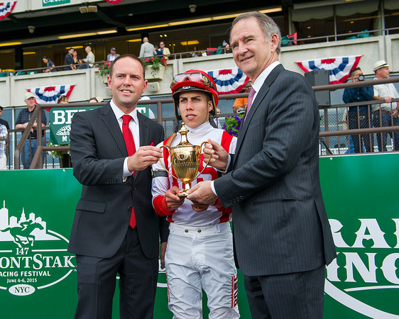 Trainer Chad Brown, Jockey Irad Ortiz, Jr., and New York Racing Association CEO Chris Kay with the Belmont Gold Cup.