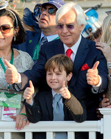 Trainer Bob Baffert and son Bode Baffert give a thumbs up in the winner's circle after winning the 147th Belmont Stakes (GI) and the Triple Crown.