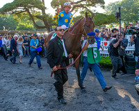 Victor Espinoza waves at fans as American Pharoah walks to the track for the post parade before winning the 147th Belmont Stakes (GI) and becoming the 12th Triple Crown winner at Belmont Park in Elmon