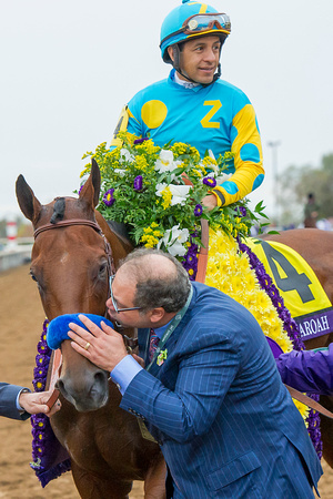 Owner Ahmed Zayat gives Triple Crown winner American Pharoah a kiss after winning the Breeders' Cup Classic (GI) and becoming the first "Grand Slam" champion.