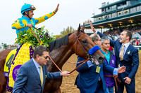 Justin Zayat reaches out to high five Victor Espinoza after Triple Crown winner American Pharoah, won the Breeders' Cup Classic (GI) and became the first "Grand Slam" champion.