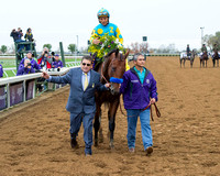 Assistant trainer Jimmy Barnes walks Triple Crown winner American Pharoah, after winning the Breeders' Cup Classic (GI) and becoming the first "Grand Slam" champion.