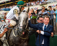 Bobby Flay walks Creator down Victory Lane after winning the Grade I Belmont Stakes at Belmont Park in Elmont, New York.