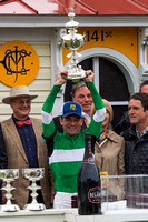 Preakness winning Jockey Kent Desormeaux celebrates with the trophy at Pimlico Race Course in Baltimore, Maryland.