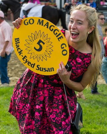 Connections of Black Eyed Susan winner Go Maggie Go, holds the paddock sign in celebration at Pimlico Race Course in Baltimore, Maryland.