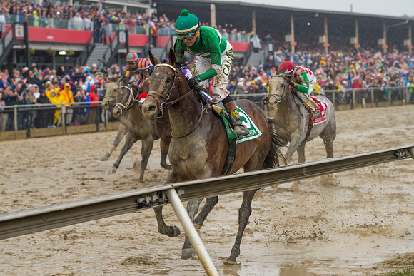 Exggerator, ridden by Kent Desormeaux and trained by Keith Desormeaux, wins the Preakness Stakes at Pimlico Race Course in Baltimore, Maryland.