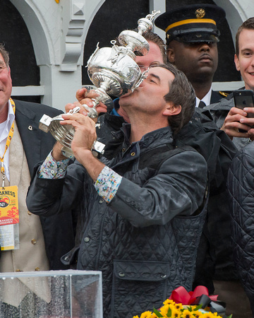 Keith Desormeaux trainer of Preakness Stakes winner Exaggerator, kisses the trophy at Pimlico Race Course in Baltimore, Maryland.