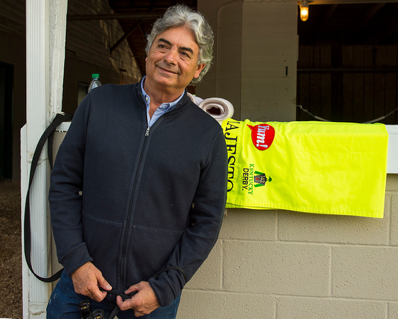 Trainer Gustavo Delgado, with his Kentucky Derby entrant's training saddlecloth at Churchill Downs in Louisville, Kentucky.