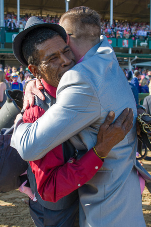 Harry Mayers, groom of Cathryn Sophia, hugging Cash Is King Stables connections, after winning the Kentucky Oaks at Churchill Downs in Louisville, Kentucky.