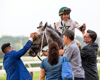 Irad Ortiz Jr. celebrates his Belmont Stakes win aboard Creator with Assistant Trainer Toby Sheets at Belmont Park in Elmont, New York.