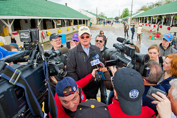 Art Sherman, trainer of early Kentucky Derby 140 favorite California Chrome is surrounded by media.
