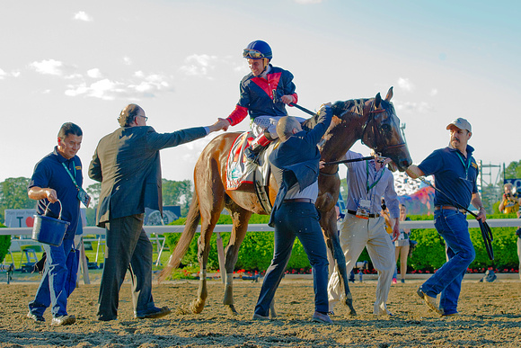 Joel Rosario celebrates with trainer Christophe Clement after winning the Belmont Stakes with Tonalist at Belmont Park in New York.