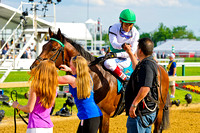 Edgar Prado celebrates after winning the Dixie Stakes with Utley at Pimlico Race Course in Baltimore, Maryland.