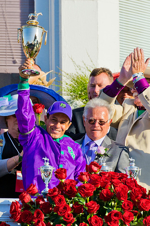 Victor Espinoza celebrates winning the 140th Kentucky Derby aboard California Chrome.