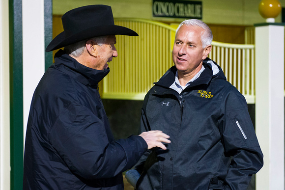 Hall of Fame thoroughbred racing trainers D. Wayne Lukas and Tood Pletcher chat on opening night of the 2015 Spring meet at Churchill Downs in Louisville, Kentucky.