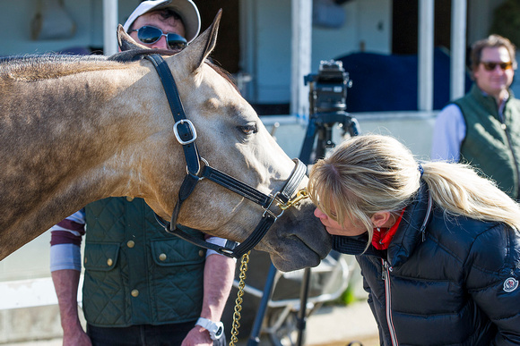 Jill Baffert gets kisses from Baffert stable pony Smokey.
