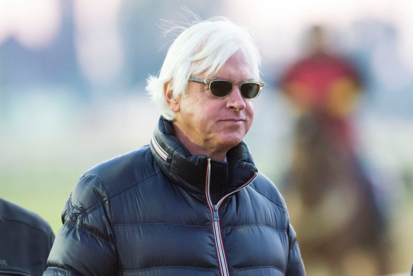 Bob Baffert watches his horses exercise during morning workouts at Churchill Downs in Louisville, Kentucky.