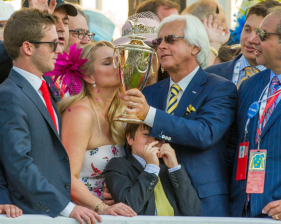 Jill Baffert, wife of Bob Baffert trainer of Kentucky Derby (GI) winner American Pharoah, kisses the trophy in the winners' circle.