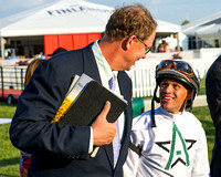 WinStar Farms CEO Elliott Walden congratulates winning rider Javier Castellano after winning the Pimlico Special (GIII) with Commissioner at Pimlico Race Course in Baltimore, Maryland.