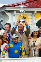 Zayat Stables owner Ahmed Zayat hoists the Preakness trophy high after winning the Xpressbet.com Preakness Stakes (GI) with American Pharoah at Pimlico Race Course in Baltimore, Maryland.