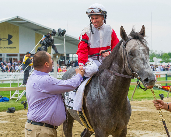 Javier Castellano celebrates with assistant trainer Robbie Medina after winning the 2015 Longines Dixie Stakes (GII) aboard Ironicus at Pimlico Race Course in Baltimore, Maryland.