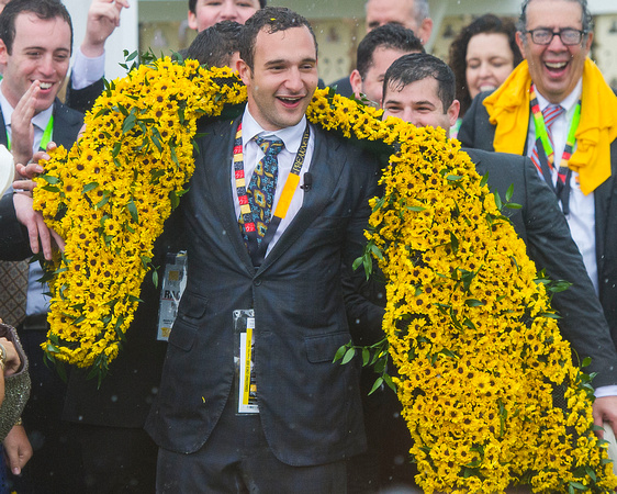 Zayat Stable Manager Justin Zayat drapes himself with the blanket of Black Eyed Susans after winning the Xpressbet.com Preakness Stakes (GI) with American Pharoah at Pimlico Race Course in Baltimore,