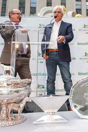 American Pharoah trainer Bob Baffert points at the Triple Crown Trophy at the Belmont Stakes Festival Post Draw in Rockefeller Center in Manhattan, New York.