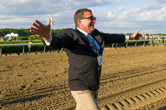 Assistant trainer Jimmy Barnes celebrates after American Pharoah won the 147th Belmont Stakes (GI) and became the 12th thoroughbred race horse to win the Triple Crown.