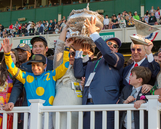 Victor Espinoza, Ahmed Zayat and Bob Baffert, celebrate in the winners' circle after American Pharoah won the 147th Belmont Stakes (GI) and became the 12th thoroughbred race horse to win the Triple Cr
