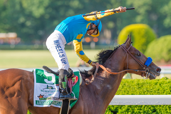Victor Espinoza celebrates after  American Pharoah won the 147th Belmont Stakes (GI) and became the 12th thoroughbred race horse to win the Triple Crown.