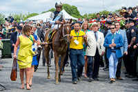 Partners of Eclipse Thoroughbred lead Curalina down Victory Lane to the winners' circle after winning the Acorn Stakes (GI) at Belmont Park in Elmont, New York.
