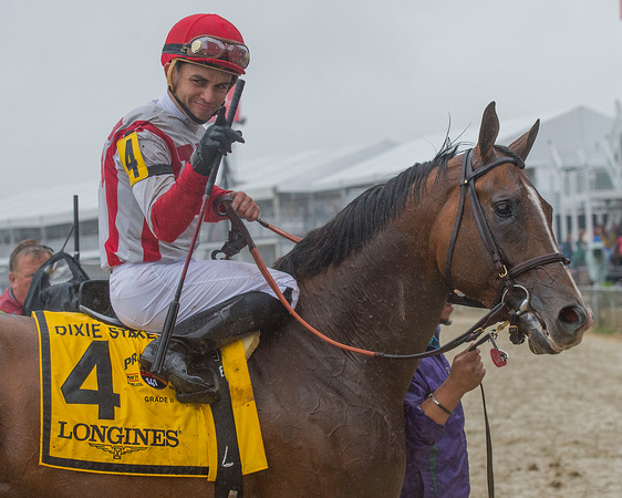 Joel Rosario celebrates after winning the GII Dixie Stakes aboard Takeover Target at Pimlico Race Course in Baltimore, Maryland.