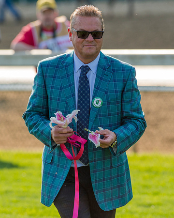 Trainer John Servis  celebrates with some lillies after winning the 142nd running of the Kentucky Oaks at Churchill Downs in Louisville, Kentucky.