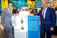 Justin Zayat (left) and Ahmed Zayat (right) owners of Triple Crown and Grand Slam winner American Pharoah, pose with the Kentucky Derby trophy at the Kentucky Derby Museum's new American Pharoah exhib