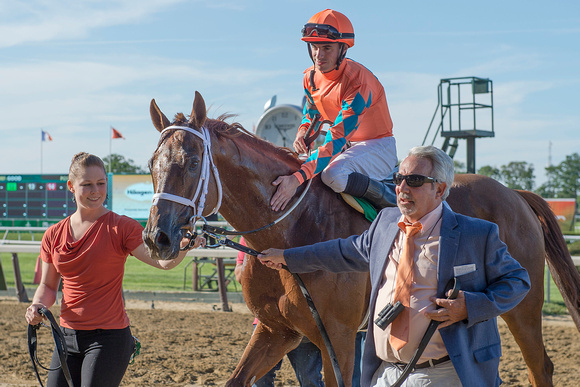 Da Big Hoss, winner of the Belmont Gold Cup invitational, ridden by Florent Geroux and trained by Mike Maker, being escorted into the winners' circle by Harvey Diamond (right) of Sky Chai Racing.