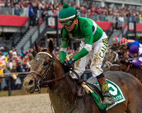 Exggerator, ridden by Kent Desormeaux and trained by Keith Desormeaux, wins the Preakness Stakes at Pimlico Race Course in Baltimore, Maryland.
