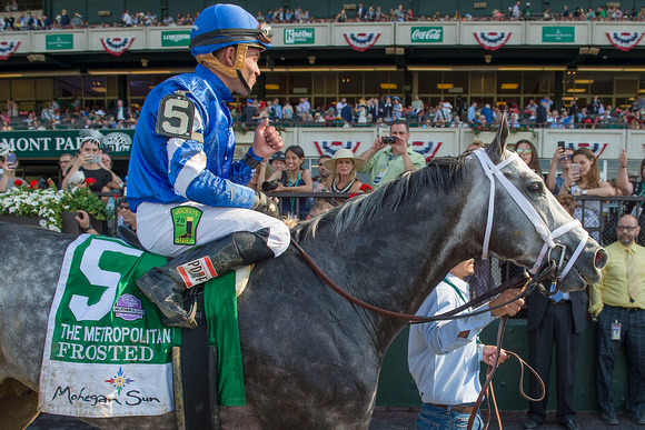 Joel Rosario celebrates  after winning the Grade I Metropolitan Mile Stakes with Frosted at Belmont Park in Elmont, New York.