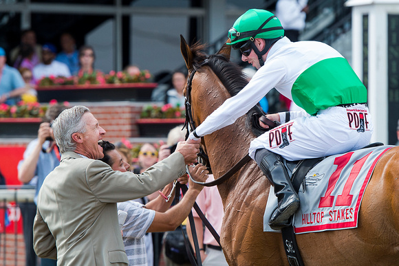 Trainer Michael Matz and jockey Florent Geroux celebrate after winning the Hilltop Stakes with Gone Away at Pimlico Race Course in Baltimore, Maryland.