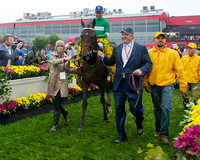 Owner Matt Bryan walks Preakness winner Exaggerator into the winners circle at Pimlico Race Course in Baltimore, Maryland.