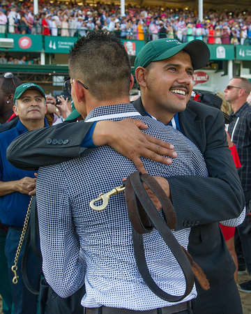 Exercise rider Jonny Garcia celebrates with connections after Nyquist with Mario Gutierrez aboard, won the 142nd Kentucky Derby at Churchill Downs in Louisville, Kentucky.