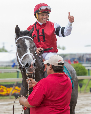 Javier Castellano, aboard Mizz Money, gives a thumbs up after winning the GIII Galorette Stakes at Pimlico Race Course in Baltimore, Maryland.