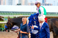 Trainer Bob Baffert gives a thumbs up to groom Eduardo Luna after Arrogate and jockey Mike Smith won the 2017 Pegasus World Cup Invitational at Gulfstream Park.
