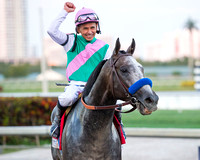 Jockey Mike Smith and  Arrogate celebrate after winning the 2017 Pegasus World Cup Invitational at Gulfstream Park.