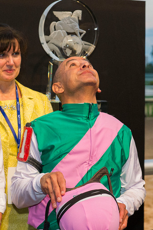 Jockey Mike Smith looks to the sky after winning the 2017 Pegasus World Cup Invitational at Gulfstream Park.