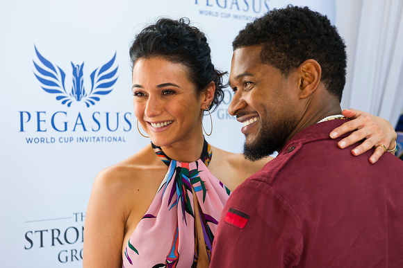 Actress Emmanuelle Chriqui and Singer Usher pose for pictures at 2017 Pegasus World Cup Invitational Day at Gulfstream Park in Hallandale Beach, Florida.