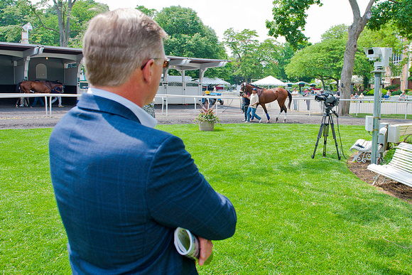 Centennial Farms principal Don Little  watches Belmont Stakes contender Wicked Strong as he schools in the paddock at Belmont Park in New York.