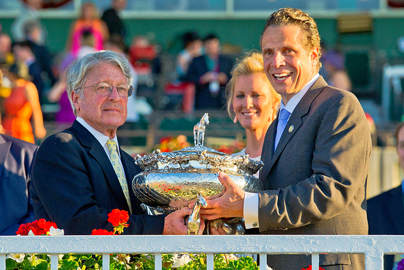 Robert Evans, owner of Tonalist, celebrates winning the Belmont Stakes with New York Governor Andrew Cuomo at Belmont Park in Nww York.